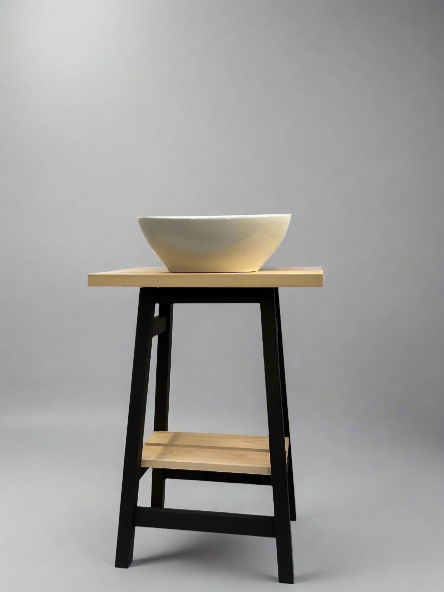 Freestanding Vanity Wash Stand , Stool style with black legs and frame and light poine top and slatted pine shelf beneath for storing towels. 